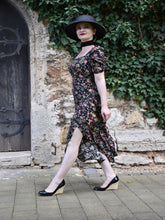 A woman wears a silk ruched dress